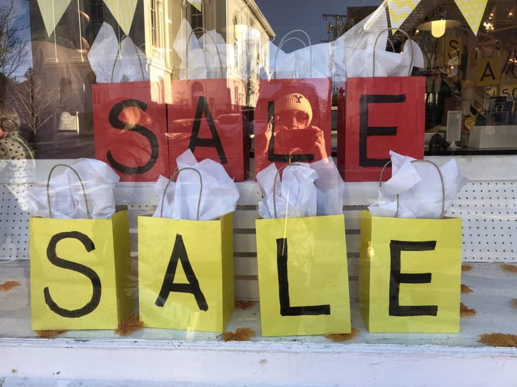 shop window displaying a sale