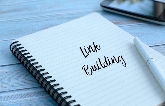 The words, "Link Building" written on a notebook