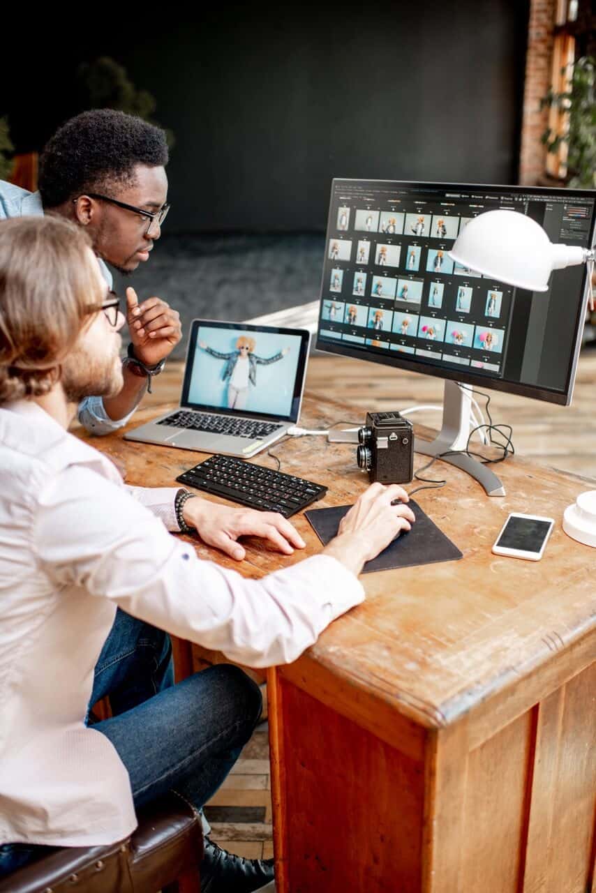 2 photographers editing